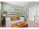 Sitting room with a comfortable daybed and a collection of framed art prints at 6219 Voyagers Pl, Apollo Beach, FL 33572