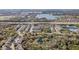 Expansive aerial view of the community, highlighting its proximity to a highway, lakes, and recreational fields at 6414 Hollydale Pl # 101, Riverview, FL 33578