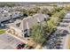 Aerial view of the property, showing the building and surrounding neighborhood with lush trees at 6414 Hollydale Pl # 101, Riverview, FL 33578