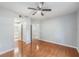 Bedroom featuring hardwood floors, access to the bathroom, and closet space for optimal storage at 6414 Hollydale Pl # 101, Riverview, FL 33578
