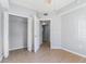 Bedroom with a closet, tiled flooring, and an open entrance at 6414 Hollydale Pl # 101, Riverview, FL 33578