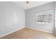 Bedroom with tiled flooring and a window for ample natural light at 6414 Hollydale Pl # 101, Riverview, FL 33578