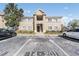 Inviting two-story condo building with well-maintained landscaping and ample parking at 6414 Hollydale Pl # 101, Riverview, FL 33578
