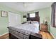 Inviting bedroom with a queen-sized bed, warm lighting, and ample closet space at 701 63Rd S St, Gulfport, FL 33707