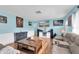 Comfortable living room featuring a large TV, plush sofas, and stylish decor at 701 63Rd S St, Gulfport, FL 33707