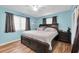Comfortable main bedroom with a large bed, ceiling fan, and ample natural light at 701 63Rd S St, Gulfport, FL 33707