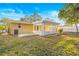 Charming backyard with a screened-in patio and well-maintained lawn at 7507 Betula Dr, New Port Richey, FL 34653