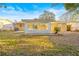 Charming backyard with a screened-in patio and well-maintained lawn at 7507 Betula Dr, New Port Richey, FL 34653
