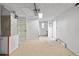 Unfinished basement with white walls, concrete floor and interior door at 7507 Betula Dr, New Port Richey, FL 34653