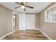 Bedroom featuring wood flooring, closet and neutral paint at 7507 Betula Dr, New Port Richey, FL 34653