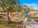 Charming single-story brick home with a well-manicured front yard and mature trees at 7507 Betula Dr, New Port Richey, FL 34653