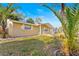 Welcoming front exterior with a cozy porch and beautiful landscaping at 7507 Betula Dr, New Port Richey, FL 34653