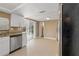 Bright kitchen featuring granite countertops, stainless appliances, and a sliding glass door at 7507 Betula Dr, New Port Richey, FL 34653