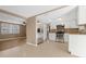 Open-concept kitchen featuring stainless steel appliances and white cabinets at 7507 Betula Dr, New Port Richey, FL 34653