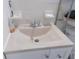 Bathroom sink with tiled backsplash, a soap dish, a modern faucet, and a white vanity at 7729 39Th N Ter, St Petersburg, FL 33709