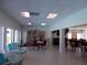 Bright community room featuring a library, tables, and cozy seating at 7729 39Th N Ter, St Petersburg, FL 33709