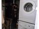 A laundry area featuring a washer and dryer, alongside a water heater and a furnace for home comfort at 7729 39Th N Ter, St Petersburg, FL 33709