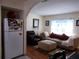 Inviting living room with a comfortable couch and ottoman, creating a cozy space for relaxation and entertainment at 7729 39Th N Ter, St Petersburg, FL 33709