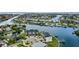 Luxury townhomes are situated on a waterfront lot near boats and other homes at 774 Gran Kaymen Way, Apollo Beach, FL 33572