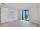 Light, bright bedroom with a large window and view, next to a spacious bathroom at 774 Gran Kaymen Way, Apollo Beach, FL 33572