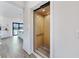 Modern home elevator with wood-paneled interior, blending convenience with a contemporary aesthetic at 774 Gran Kaymen Way, Apollo Beach, FL 33572