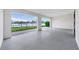 Spacious lanai with brick floors and a scenic view of the water at 774 Gran Kaymen Way, Apollo Beach, FL 33572