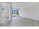 Bright, modern living room with grey floors and a large window with water views at 774 Gran Kaymen Way, Apollo Beach, FL 33572