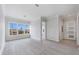 Bright living room with large window and tile flooring at 774 Gran Kaymen Way, Apollo Beach, FL 33572