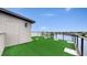 Rooftop deck features artificial turf and views of the surrounding neighborhood at 774 Gran Kaymen Way, Apollo Beach, FL 33572
