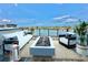 Inviting rooftop deck with stylish seating and stunning water views at 774 Gran Kaymen Way, Apollo Beach, FL 33572