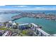 Breathtaking aerial view of beachfront condos surrounded by water and coastline on a sunny day at 7892 Sailboat Key S Blvd # 307, South Pasadena, FL 33707