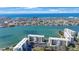 Stunning aerial view of a coastal community with multi-story buildings and captivating ocean vistas at 7892 Sailboat Key S Blvd # 307, South Pasadena, FL 33707