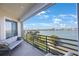 Enjoy stunning water views from this inviting balcony, complete with comfortable seating and sliding glass doors at 7892 Sailboat Key S Blvd # 307, South Pasadena, FL 33707
