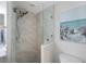 Contemporary bathroom features a glass enclosed shower with modern fixtures at 7892 Sailboat Key S Blvd # 307, South Pasadena, FL 33707