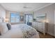 Bright bedroom offers a dresser and lovely views from the window at 7892 Sailboat Key S Blvd # 307, South Pasadena, FL 33707