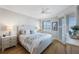 Bright bedroom offers a dresser and lovely views of the water at 7892 Sailboat Key S Blvd # 307, South Pasadena, FL 33707