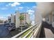 Exterior of the condo with a covered walkway and palm trees at 7892 Sailboat Key S Blvd # 307, South Pasadena, FL 33707