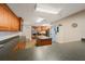 Bright, open kitchen with a large island, modern appliances, wood cabinetry, and stylish flooring at 7892 Sailboat Key S Blvd # 307, South Pasadena, FL 33707