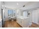 Bright kitchen with stainless steel appliances, white cabinets, and a breakfast nook with bay window at 7892 Sailboat Key S Blvd # 307, South Pasadena, FL 33707