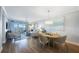 Open concept living and dining area with balcony access, offering views of the waterfront at 7892 Sailboat Key S Blvd # 307, South Pasadena, FL 33707