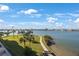 Expansive water view with swaying palm trees and a winding path, creating a serene outdoor experience at 7892 Sailboat Key S Blvd # 307, South Pasadena, FL 33707