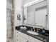 Well-lit bathroom with granite countertop, sleek fixtures, and a framed mirror at 800 S Dakota Ave # 323, Tampa, FL 33606
