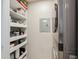 Well-organized pantry featuring floor-to-ceiling shelves packed with various food and household items at 800 S Dakota Ave # 323, Tampa, FL 33606