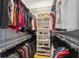 Organized walk-in closet with shelves, rods, and ample storage space for clothes and shoes at 800 S Dakota Ave # 323, Tampa, FL 33606