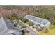 Aerial view of a well-maintained townhouse complex with mature trees at 8004 Downpatrick Ct, Tampa, FL 33610