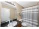 Bathroom features a vanity with a dark countertop, sink, and a shower/tub combo at 8004 Downpatrick Ct, Tampa, FL 33610