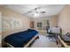 Bedroom with large windows offering views of the outdoors, and a desk at 8004 Downpatrick Ct, Tampa, FL 33610