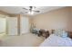 Bedroom with a bed, small table, and a window letting in natural light at 8004 Downpatrick Ct, Tampa, FL 33610