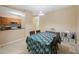 Dining area showing table with cover, and view of the kitchen at 8004 Downpatrick Ct, Tampa, FL 33610