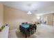 Bright dining area featuring a table with seating for four and a glass door to the outside at 8004 Downpatrick Ct, Tampa, FL 33610